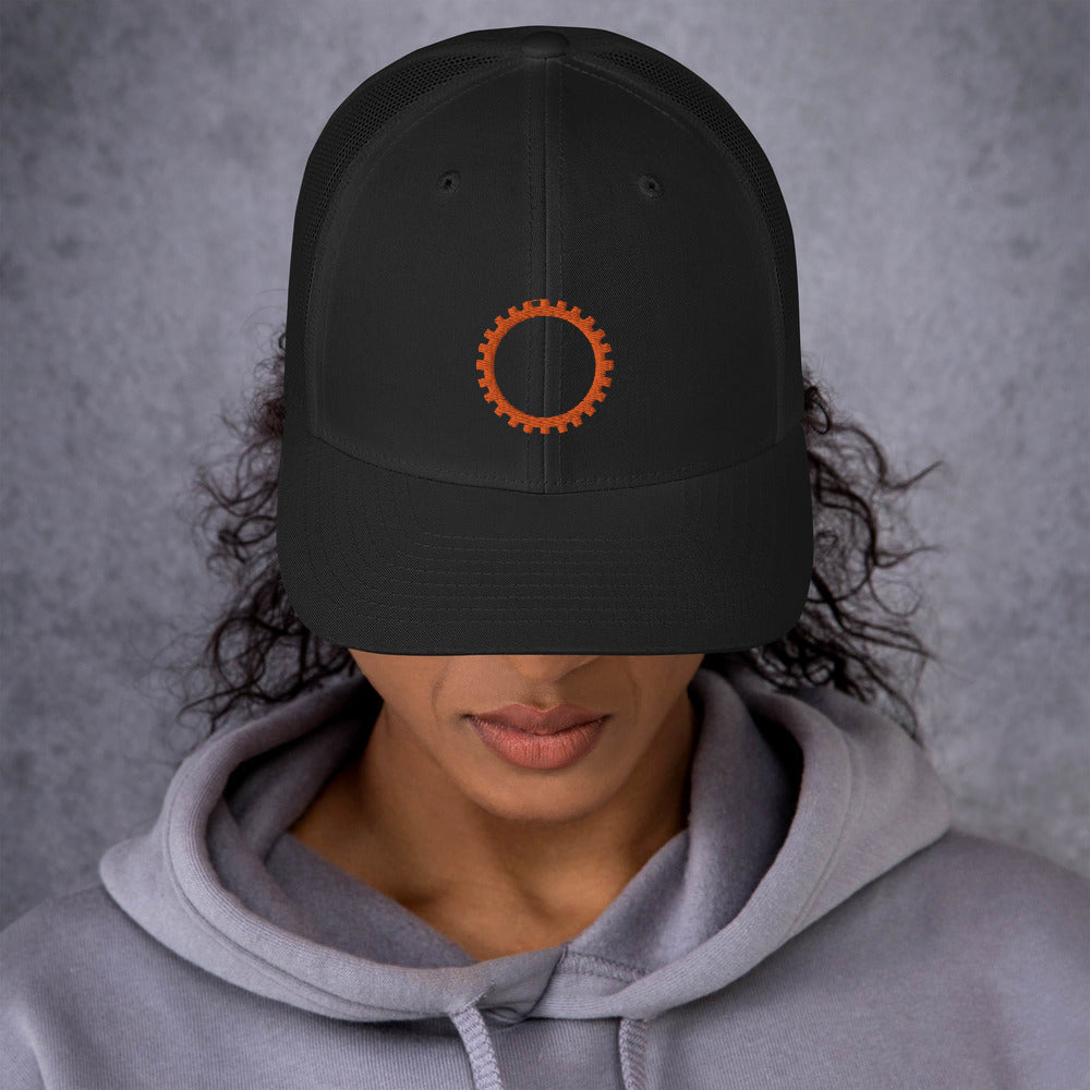 Black hat with embroidered orange sigil of mechanics and engineers