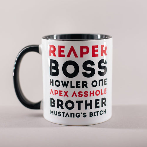 Mug with black interior and handle and text in white and black that says 'Reaper, Boss, Howler One, Apex Asshole, Brother, Mustang's Bitch'