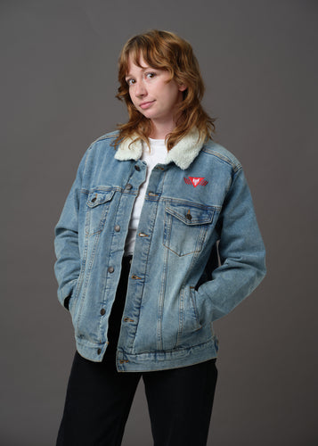 Blue denim and white sherpa jacket embroidered with the House Mars Sigil on the front right and Pegasus Legion Sigil on back