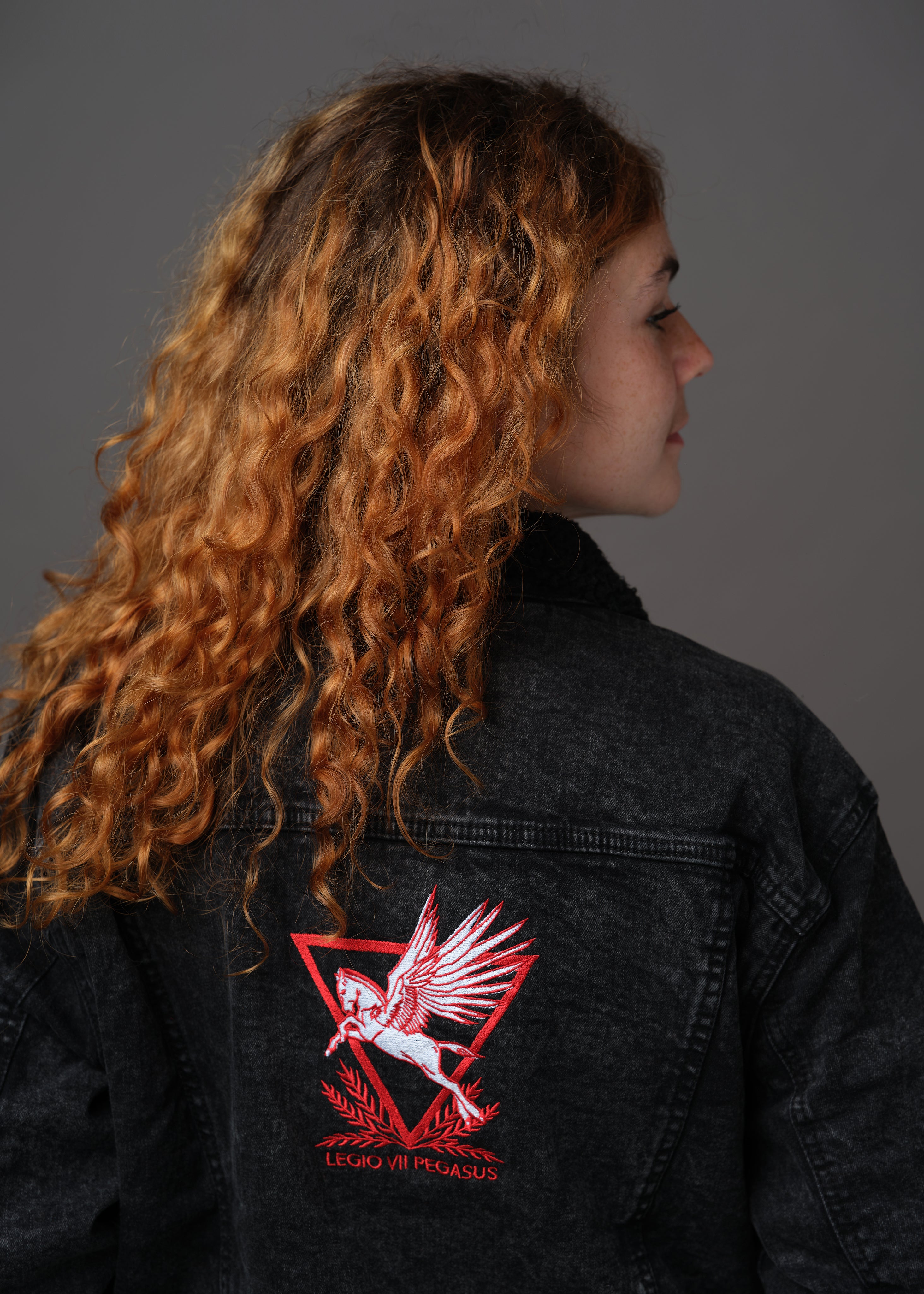 Black denim and sherpa jacket embroidered with the House Mars Sigil on the front right and Pegasus Legion Sigil on back
