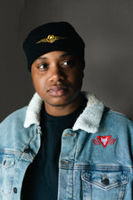 Load image into Gallery viewer, Black beanie hat with gold sigil 
