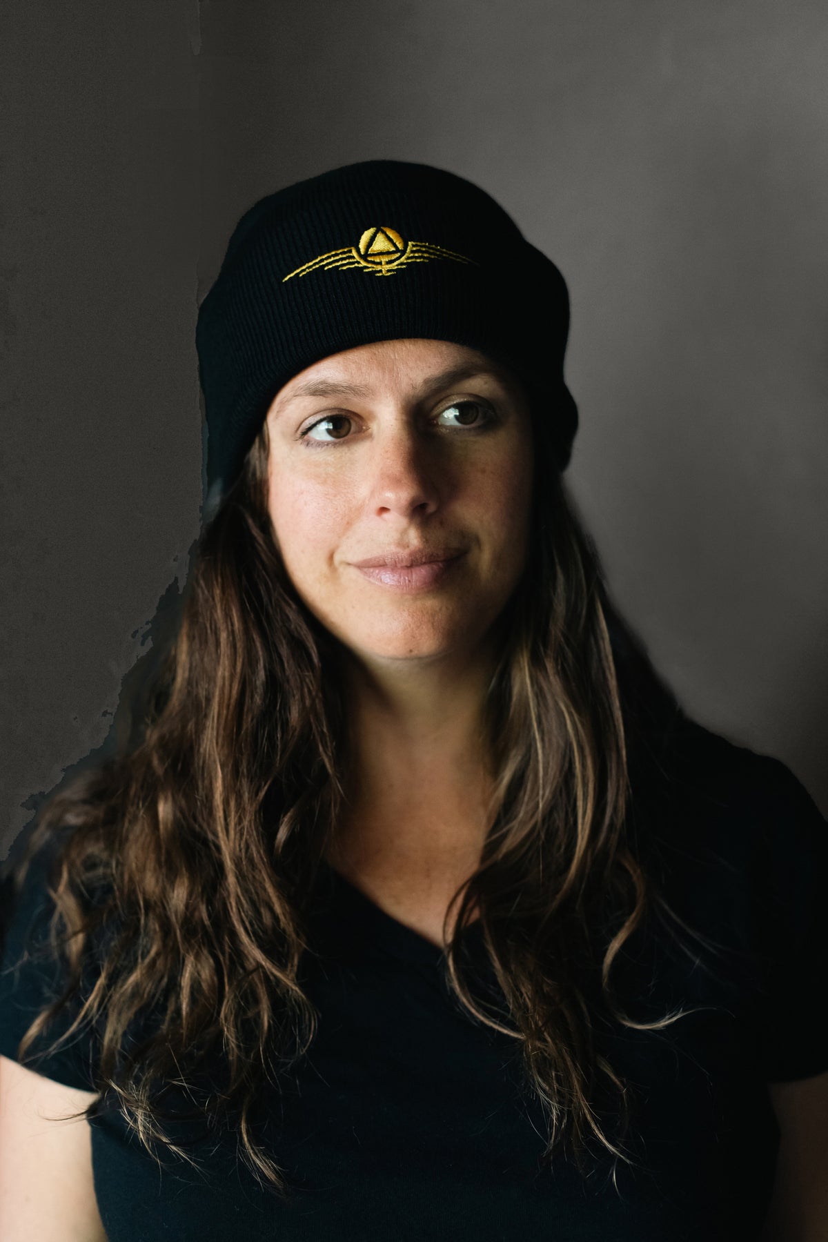 Black beanie hat with gold sigil 