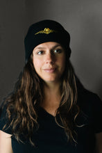 Load image into Gallery viewer, Black beanie hat with gold sigil 
