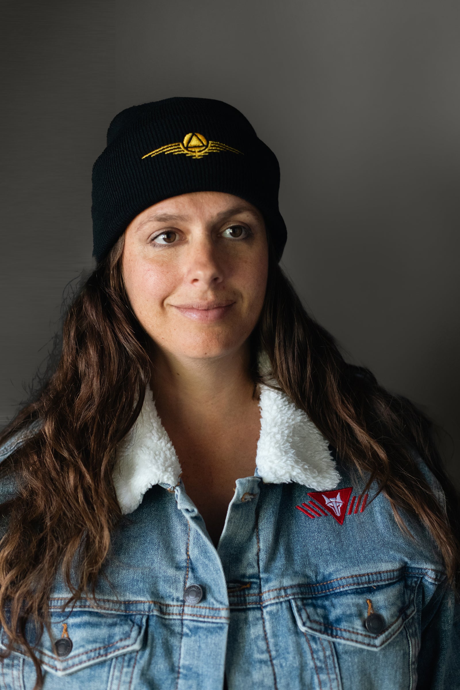 Black beanie hat with gold sigil 