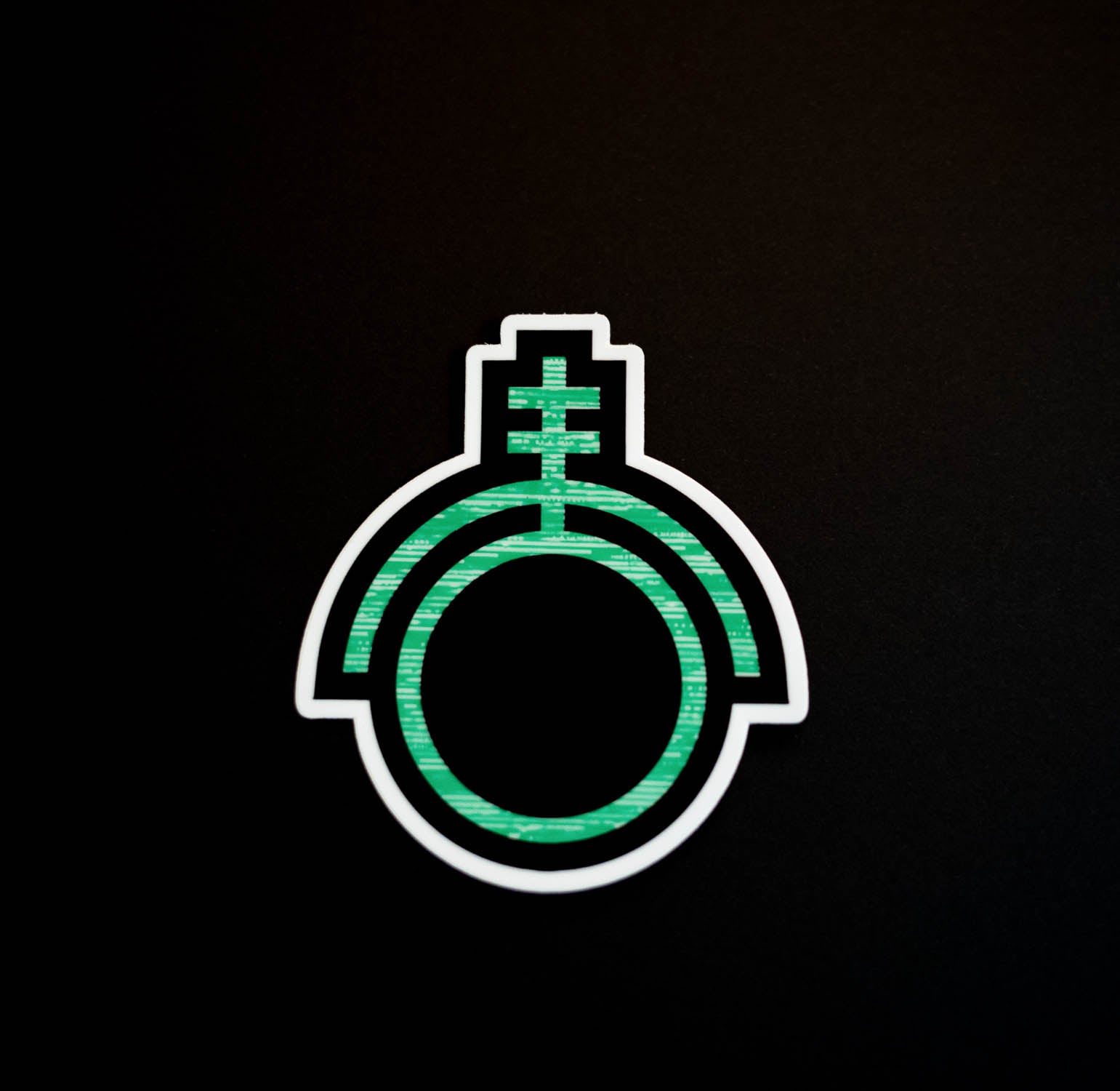 Green sticker depicting the sigil of technicians and programmers