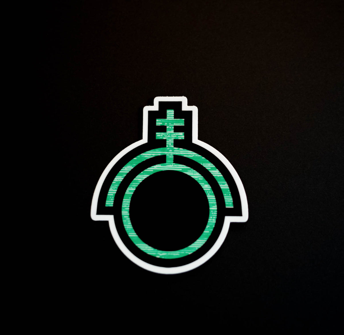Green sticker depicting the sigil of technicians and programmers