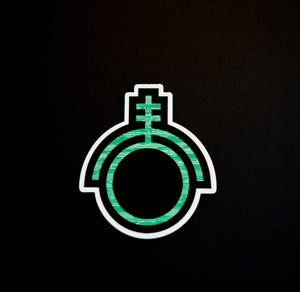 Green sticker depicting the sigil of technicians and programmers