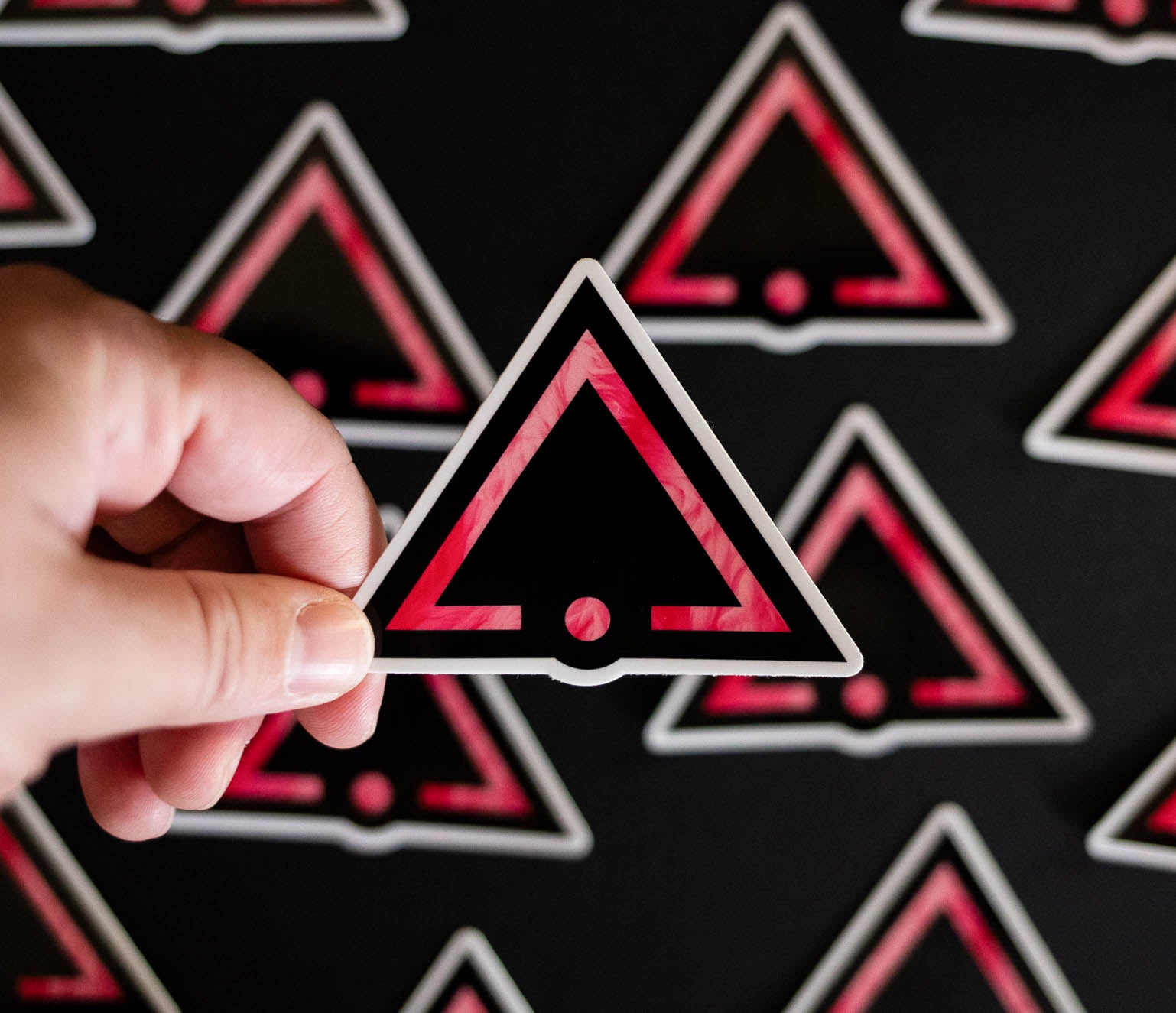 Sticker with the pink sigil of pleasure slaves and social functionaries