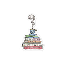 Load image into Gallery viewer, Sticker depicting a steaming tea cup and saucer on top of a stack of books that say &quot;Books, she has found, are a way to live a thousand lives.&quot;
