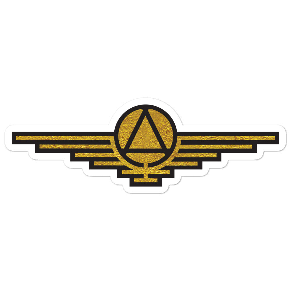 Gold sticker with black outlines depicting a triangle enclosed in a circle with wings extending on either side