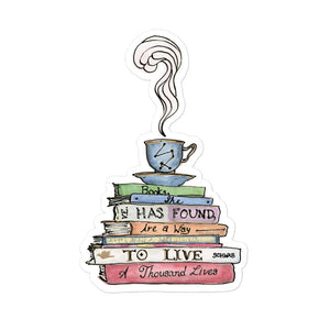 Sticker depicting a steaming tea cup and saucer on top of a stack of books that say "Books, she has found, are a way to live a thousand lives."