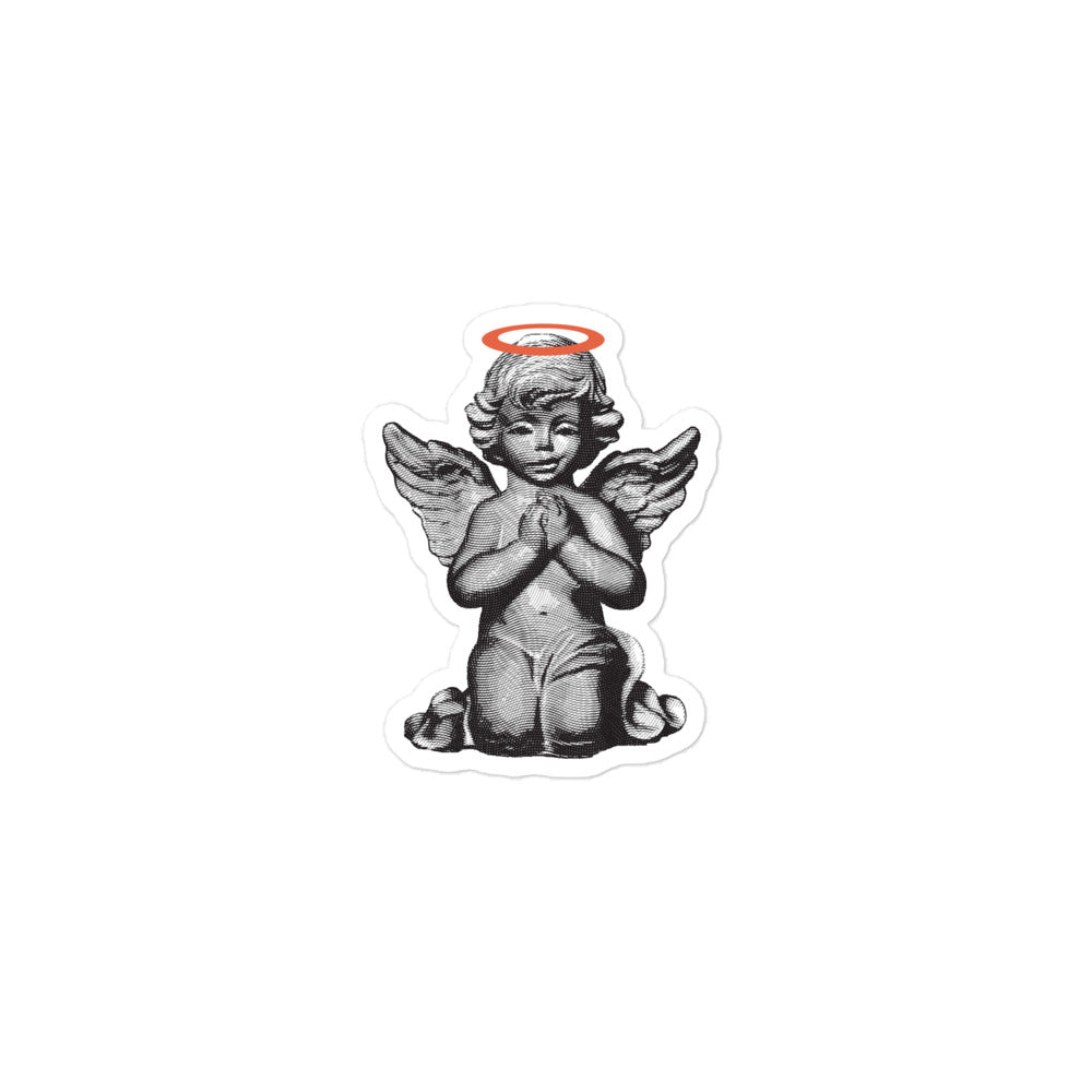 Sticker of a smirking praying angel statue with an orange halo