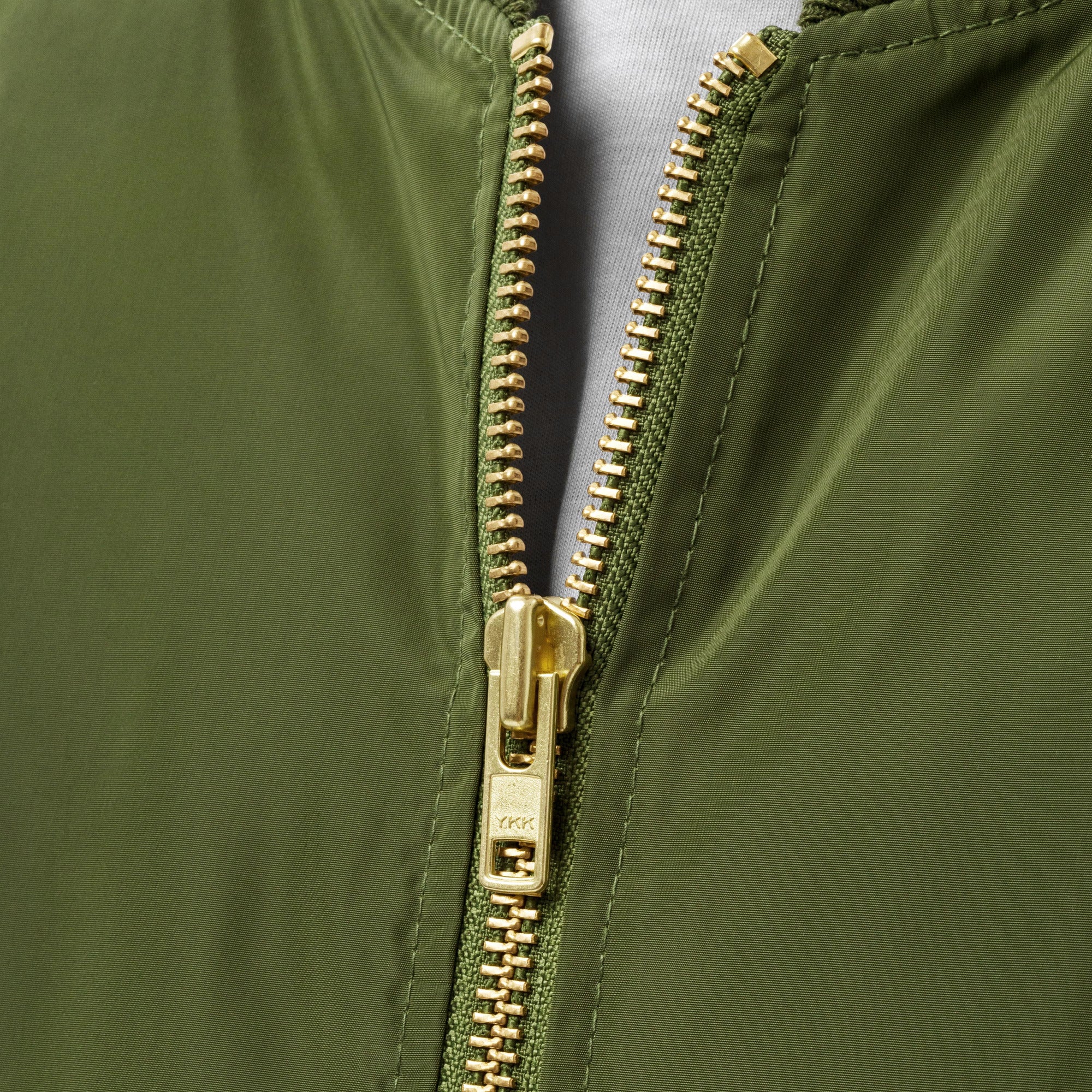 Army green bomber jacket embroidered with the House Mars Wolf Sigil on the front right and Pegasus Legion Sigil on back