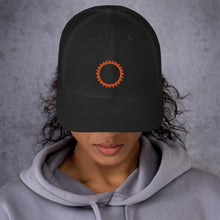 Load image into Gallery viewer, Black hat with embroidered orange sigil of mechanics and engineers

