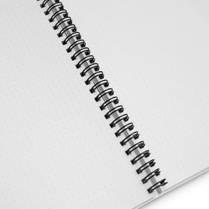 Interior of white spiral notebook with dots 