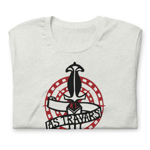 White shirt with a black and white knife with red initials KL and the phrase 'AS TRAVARS' on a scroll wrapped around, with red circles in the background