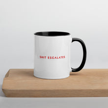 Load image into Gallery viewer, White mug with black handle and interior and Shit Escalates in red 

