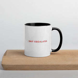 White mug with black handle and interior and Shit Escalates in red 
